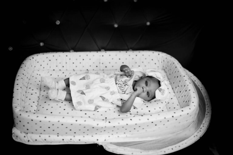 Baby sleeping peacefully in a crib at night