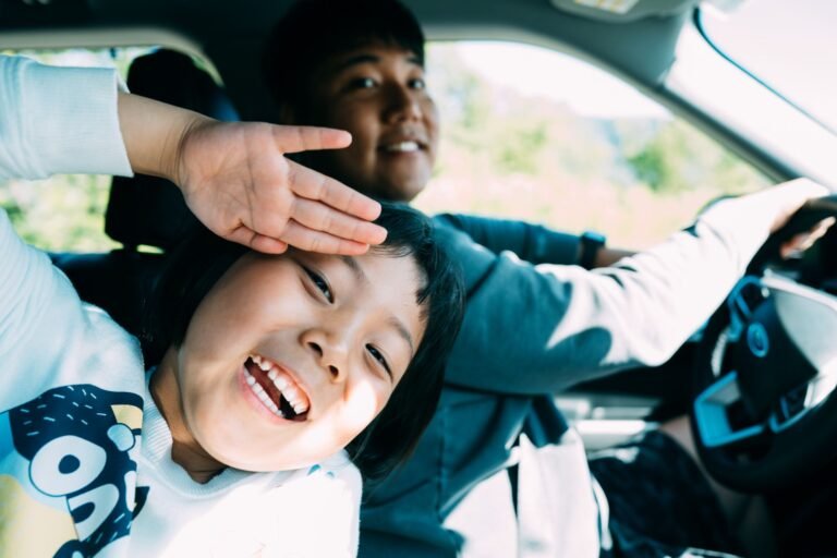 A parent and child on a car journey — comparing the Graco Extend2Fit and SlimFit3 LX convertible car seats