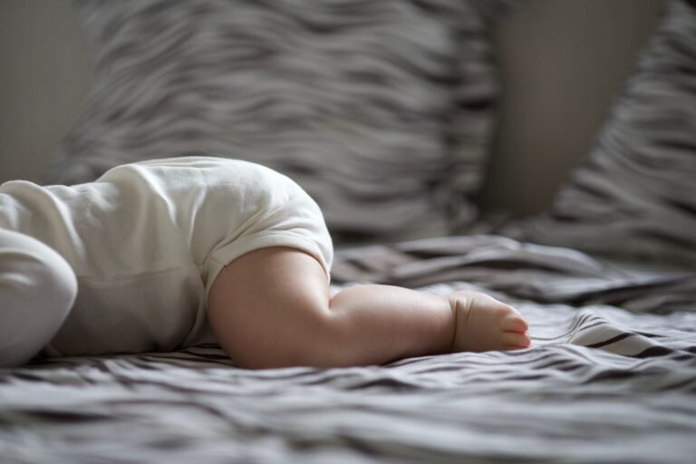 Baby sleeping peacefully in soft low light