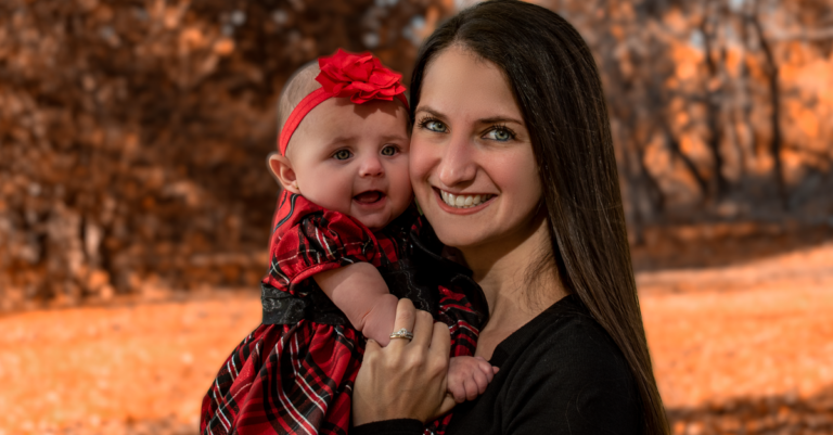 A mother holding her baby outdoors in autumn — Bebamour vs Ergobaby Omni carrier comparison