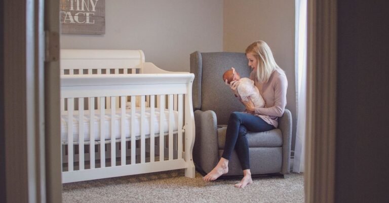 Parent settling a baby in a cosy nursery